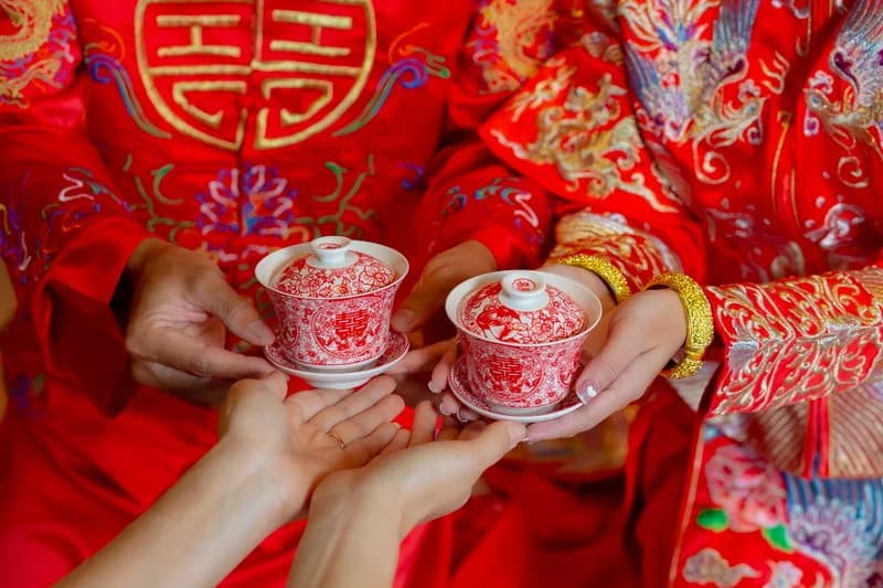 Tea cups held during a Chinese wedding ceremony in the hotel’s supplied wedding photographs