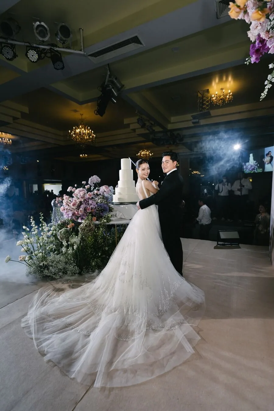 A couple dancing during an indoor wedding celebration