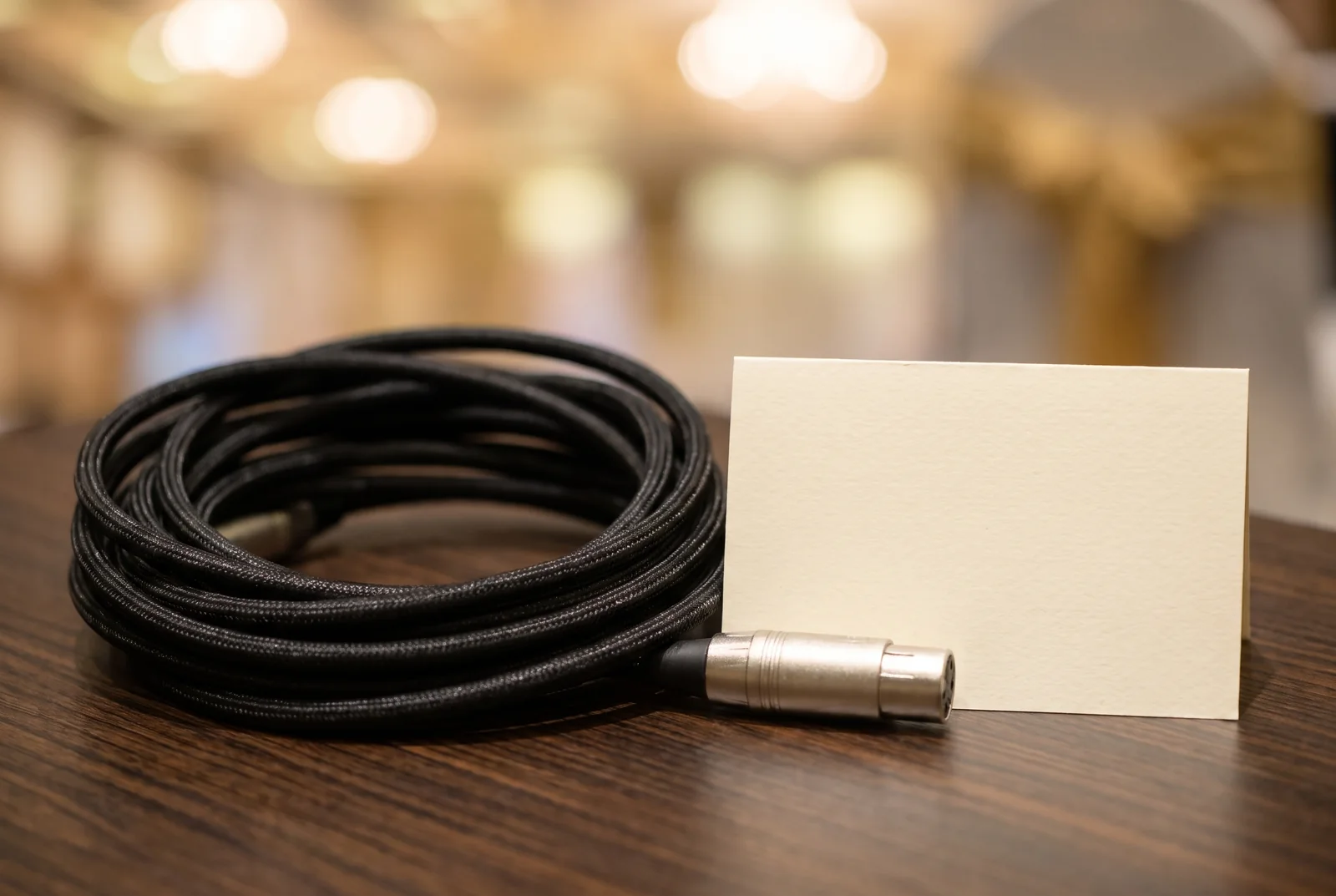 Presentation cable, connector and blank cue card — AI-generated editorial illustration